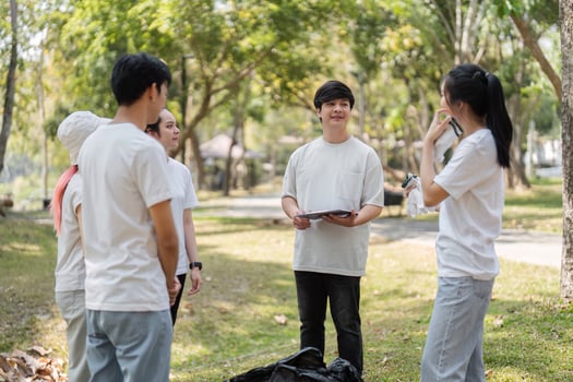 Leadership and Planning. Volunteer leader discussing tasks with the group. photo