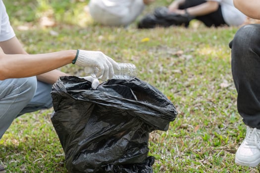 Environmental stewardship. Volunteers focusing on waste collection in the park. photo