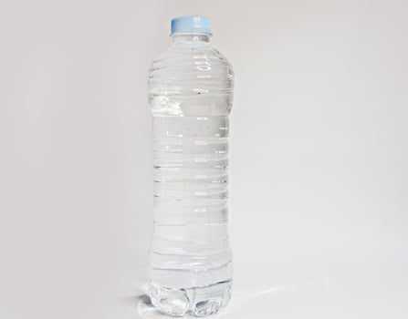 Large plastic water bottle isolated on white background photo