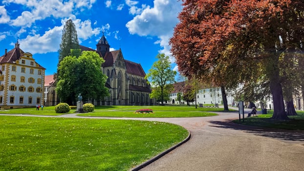 Great view of the parc and gothic Minster Salem on a sunny summer day. Minster Salem is the third largest church built in Baden-Wuerttemberg, Germany. photo