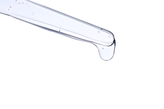 Pipette with delicate blue serum close-up. photo