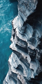 Coastal rock formations beside ocean photo