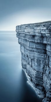 Cliffside view over calm waters photo