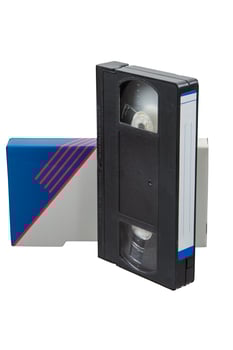 A vintage VHS tape with a blue and white sleeve, isolated on a white back photo