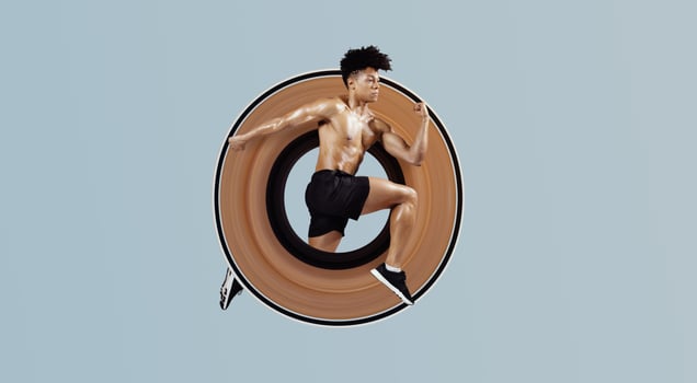Athletic fit man sprinting and leaping forward with arms tensed, having sport training on soft blue background. Guy having workout, running in mid air. Full length shot with copy space, side view photo