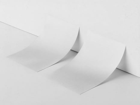 Two flyers leaning against a wall photo
