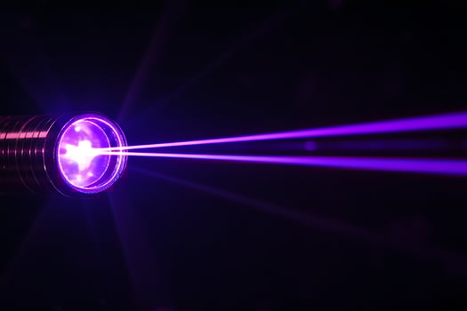 Dual Purple Laser Beams in Motion photo