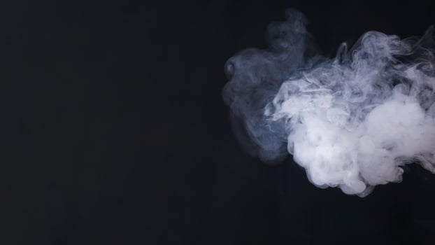 Abstract white smoke or fog isolated on black background photo