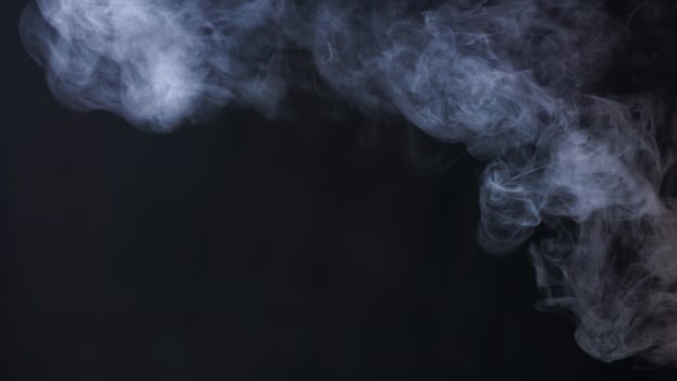 Abstract white smoke isolated on black background studio photo