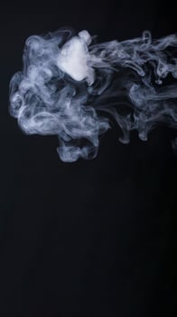 Abstract smoke or fog isolated on black background photo