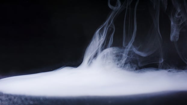 Dense abstract smoke isolated on black background studio photo