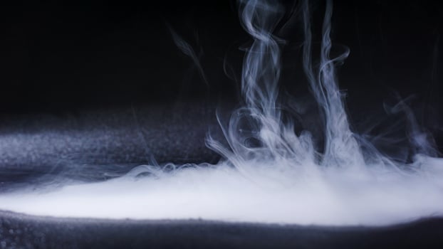 Dense fog or smoke isolated on black background photo