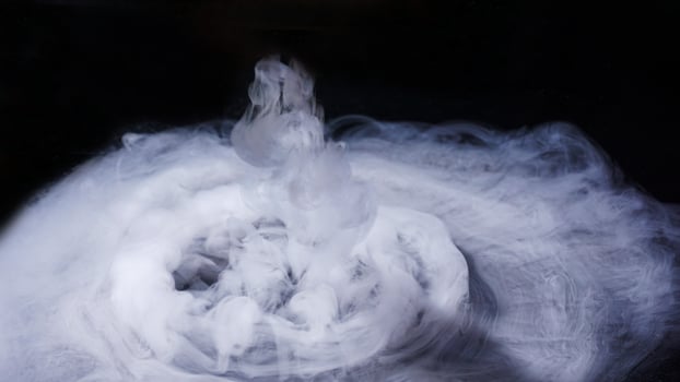 Dense abstract smoke or fog isolated on black background photo