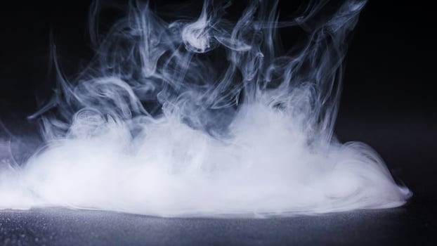 Dense smoke or fog isolated on black background photo