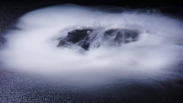Dense abstract fog isolated on black background photo