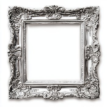 A decorative, ornate silver picture frame with intricate designs and no image inside. photo