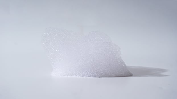 Soap foam isolated on white background photo