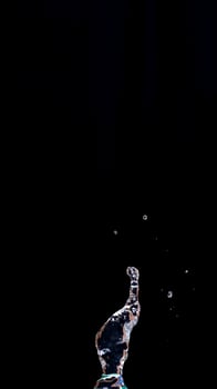 Real water splash isolated on black background photo