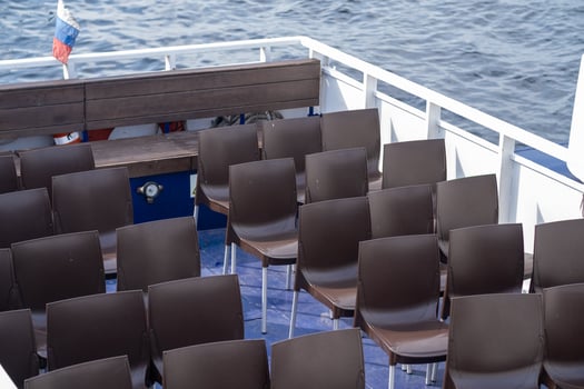 Chairs arranged on a boat in Saint Petersburg ready for passengers on a scenic cruise photo
