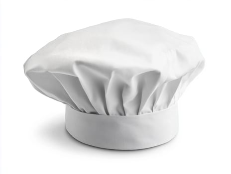 Chef hat placed on a white background for culinary presentation photo