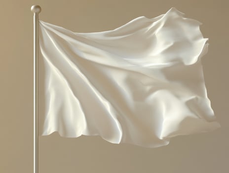 White flag waving gently on a flagpole against a soft background photo