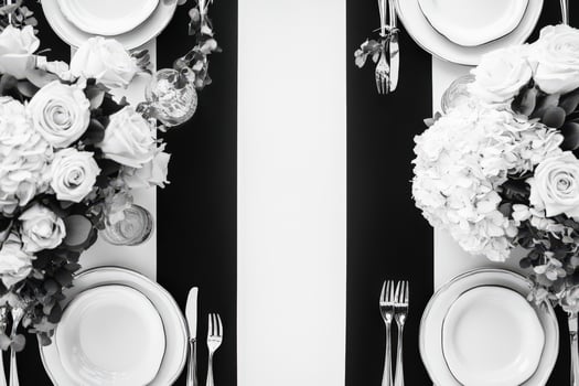 Elegant Black and White Table Setting with Flowers photo