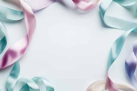 Pastel ribbons form a delicate frame on white background photo