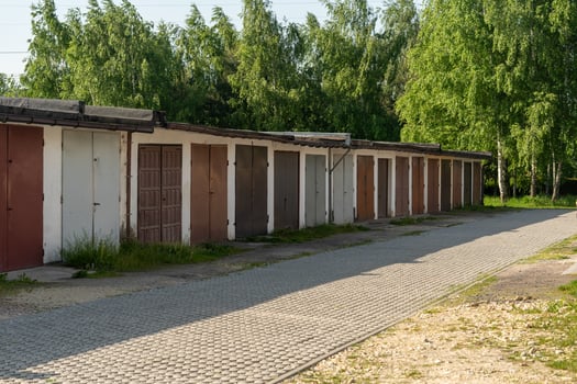 Rows of old garages with colorful metal doors in Poland village photo