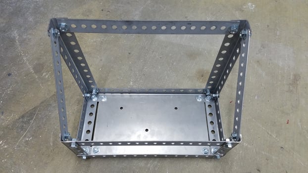 A Custom Metal Gas Can Holder for 4x4 Vehicle Made from Steel Perforated Angle photo
