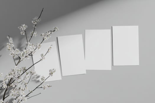 Minimalistic arrangement of four blank posters floating over a sleek gray background with soft shadows photo