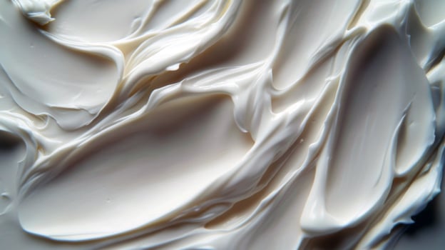 Smooth creamy texture of white whipped body butter or moisturizer surface photo