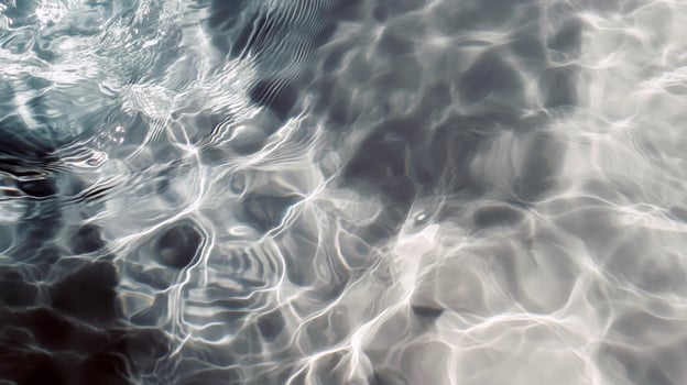 Turquoise pool water with sunlight reflections and ripple patterns photo