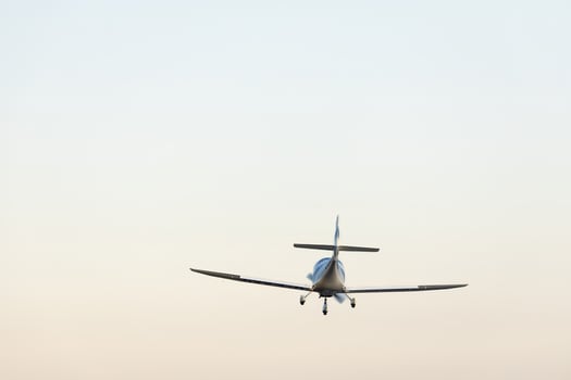 small plane in the air. concept in articles and advertising materials related to aviation, air travel, private jets and flight school. photo