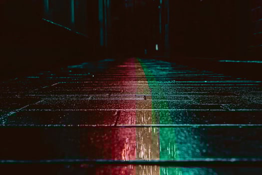 Vibrant reflections on a rain-soaked street. photo