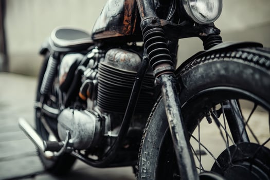 Vintage motorcycle gleams under soft morning light. photo