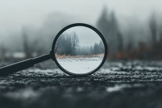 Exploring winter through a magnifying glass in the forest. photo