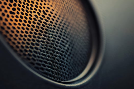 Intricate details of a speaker's grill up close. photo