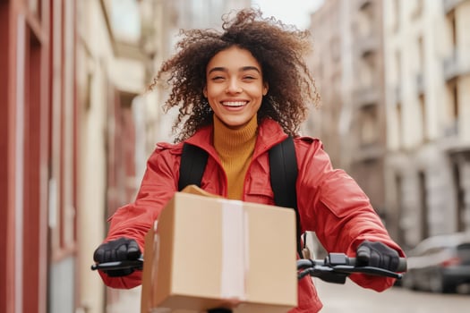 Happy Delivery Woman Riding Bicycle With Package photo