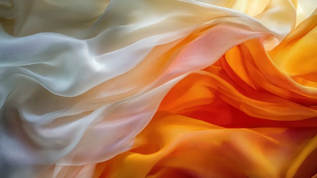 Elegant Draped Fabric in Warm Hues of White and Orange photo