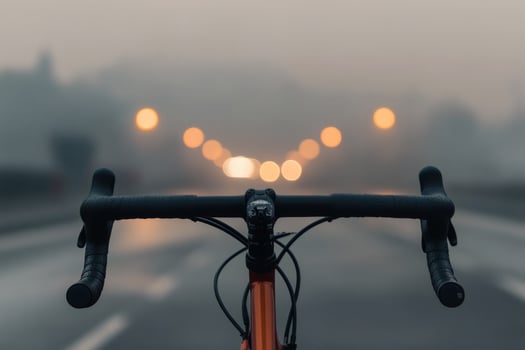 Riding into a misty dawn on a quiet empty road. photo