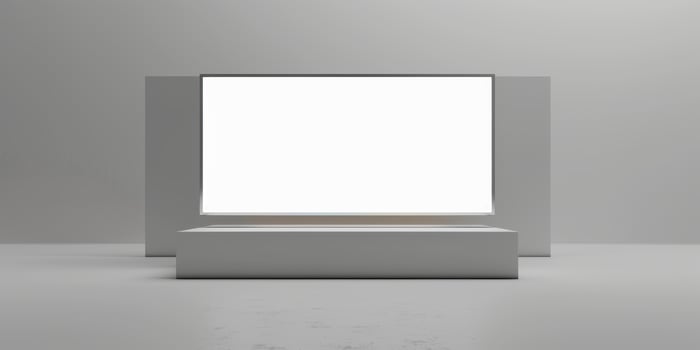 An empty white square frame on a gray floor photo