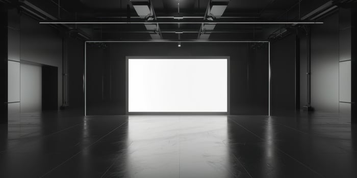 An empty room with a white light in the middle photo