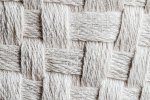 Intricate texture of woven fabric in neutral tones. photo