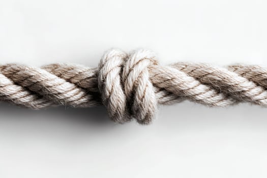 Rope knot intricately tied demonstrating craftsmanship. photo