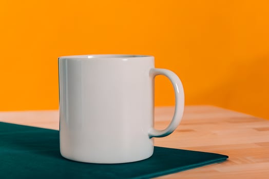 White Clean Ceramic Coffee Mug on a Wooden Table photo