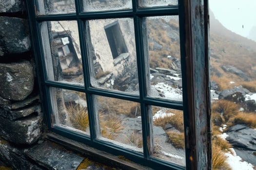 View from a weathered window in a misty mountain landscape. photo