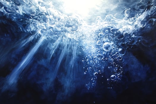 Underwater sunlight piercing through surface with air bubbles rising photo