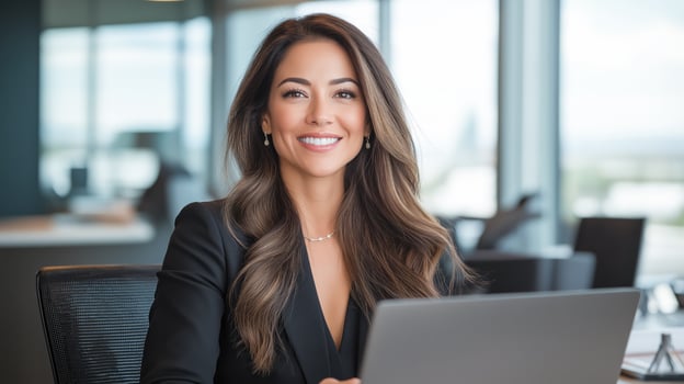 Business woman in a stylish office with a laptop. photo