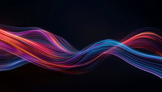 Vibrant, flowing light streaks in red, pink, and blue hues against a dark background photo