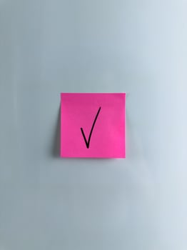 Vertical photo of check mark on sticky note to indicate your choice